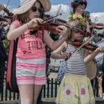 Kids playing the fiddle