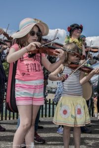 Kids playing the fiddle